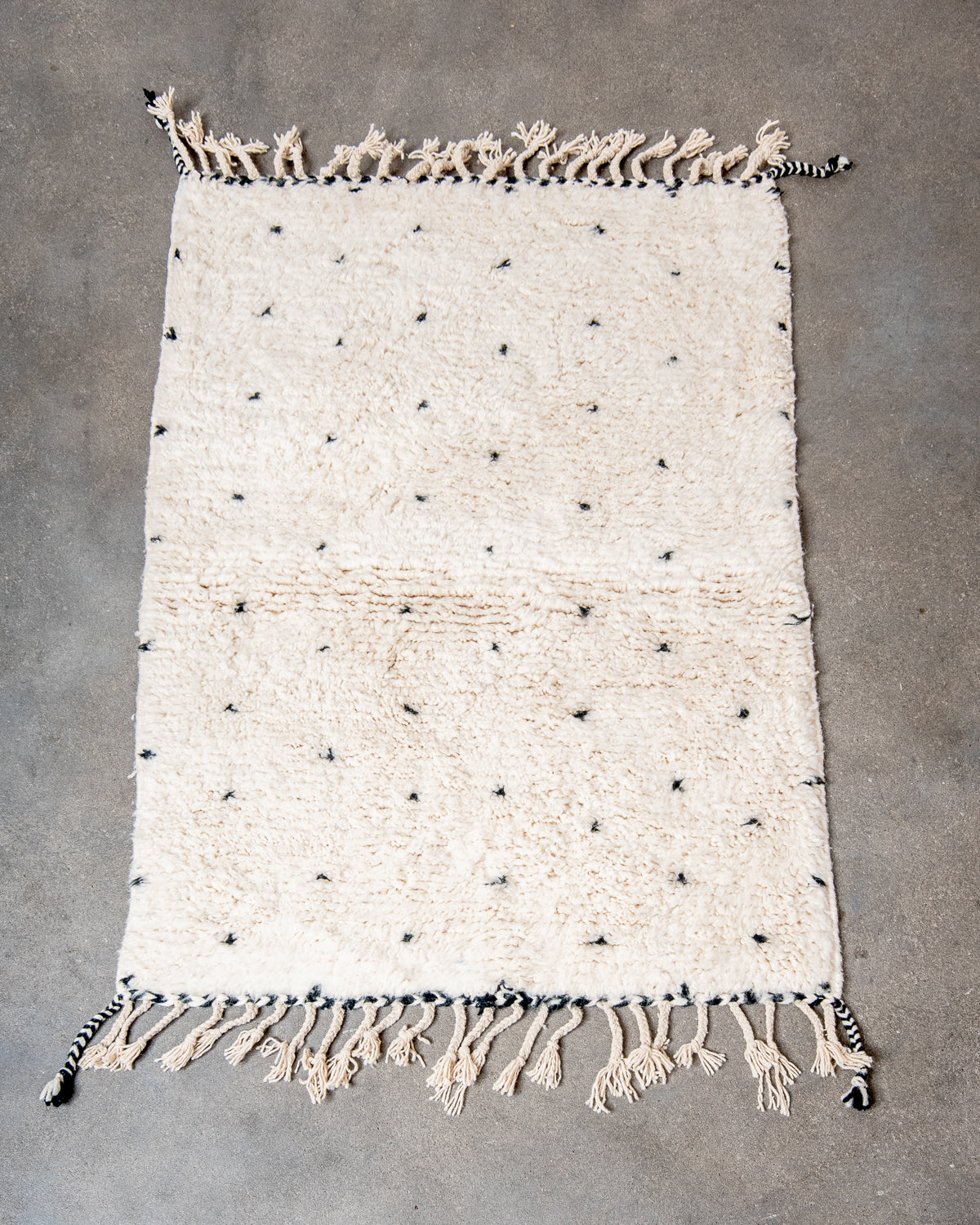 Modern, designer, handcrafted Berber rug from Morocco. Beniourain carpet with minimalist design, natural wool pile and a fluffy texture.